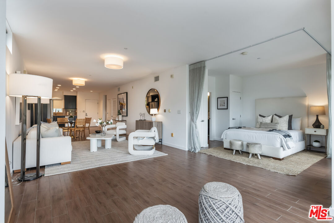 13045 Pacific Promenade, Unit 330 Los Angeles, CA 90094 - Photo 15 of 43 a living room with furniture and a wooden floor