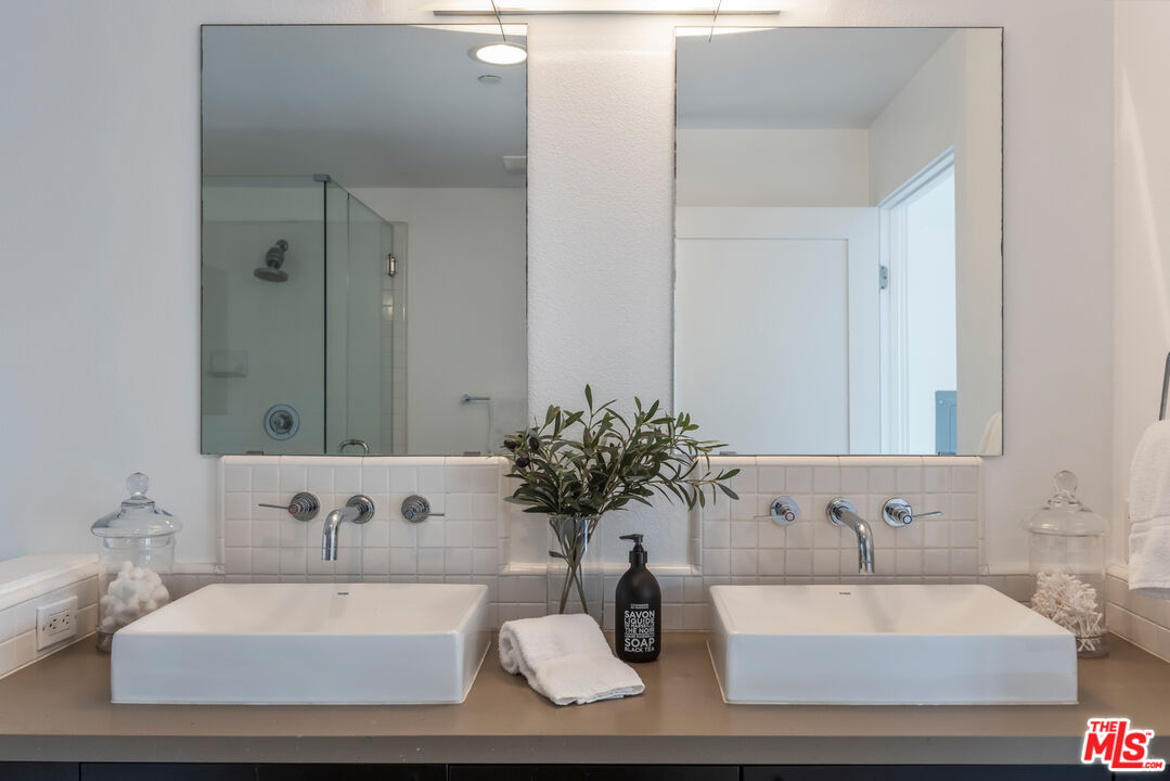 13045 Pacific Promenade, Unit 330 Los Angeles, CA 90094 - Photo 20 of 43 a bathroom with a sink and a mirror
