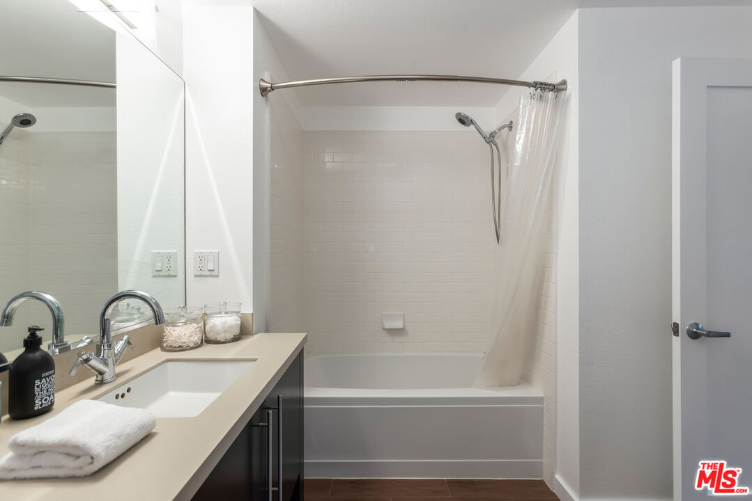 13045 Pacific Promenade, Unit 330 Los Angeles, CA 90094 - Photo 23 of 43 a bathroom with a sink and a mirror