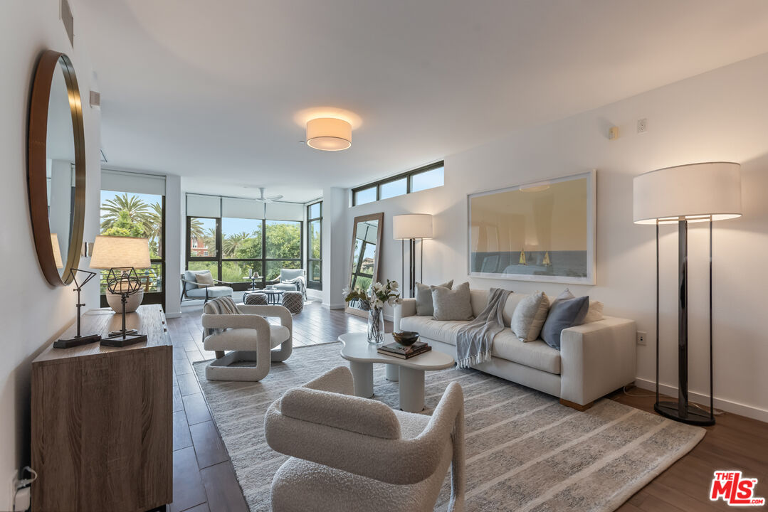 13045 Pacific Promenade, Unit 330 Los Angeles, CA 90094 - Photo 10 of 43 a living room with furniture and a large window