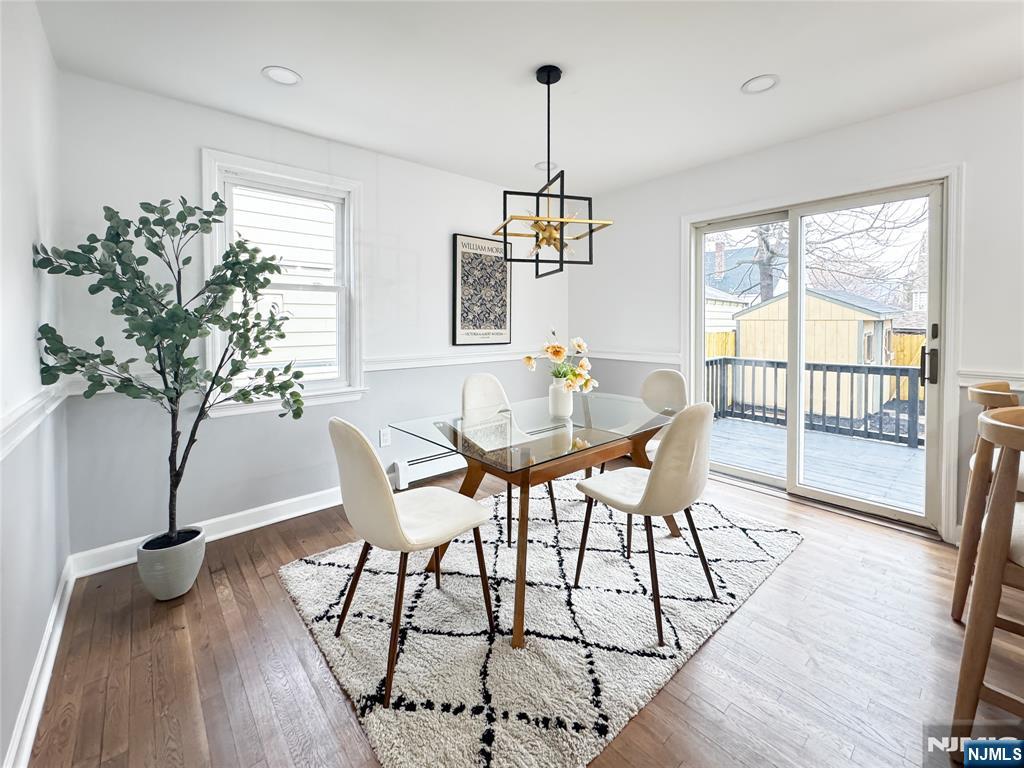 47 Elston Street Bloomfield, NJ 07003 - Photo 15 of 38 a view of a dining room with furniture window and wooden floor
