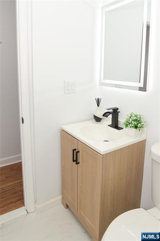 47 Elston Street Bloomfield, NJ 07003 - Photo 23 of 38 a bathroom with a sink and a toilet