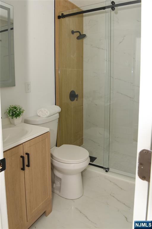 47 Elston Street Bloomfield, NJ 07003 - Photo 25 of 38 a bathroom with a sink toilet and shower