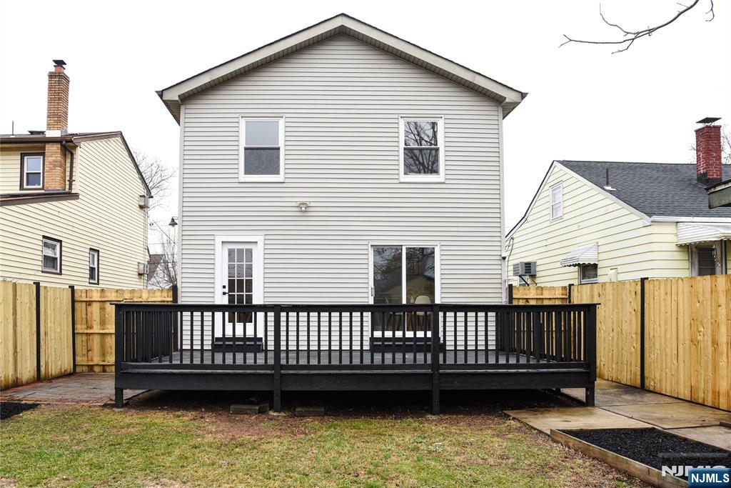 47 Elston Street Bloomfield, NJ 07003 - Photo 35 of 38 a view of a deck with a chair and wooden floor