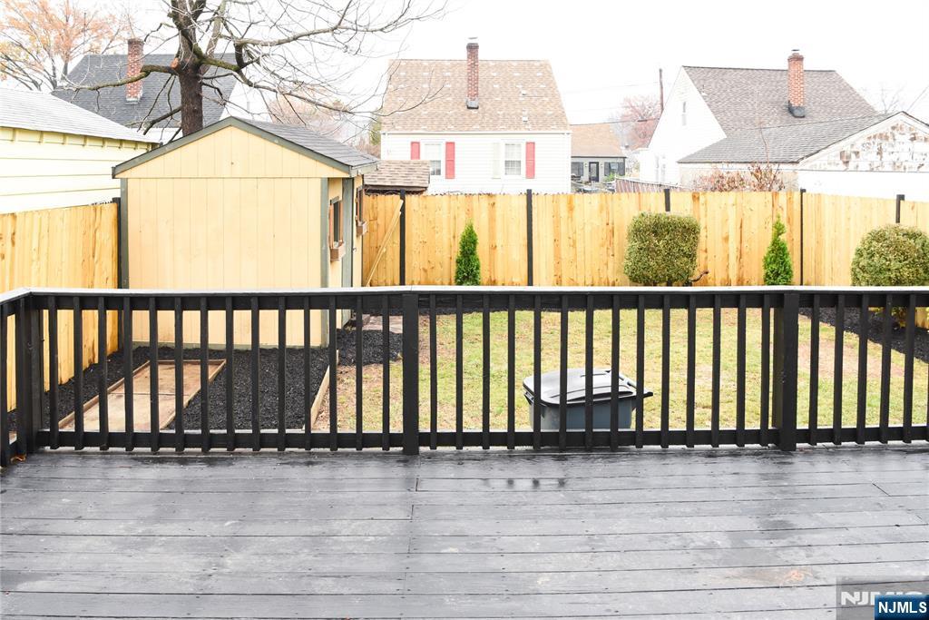 47 Elston Street Bloomfield, NJ 07003 - Photo 37 of 38 a view of a balcony with wooden floor and fence