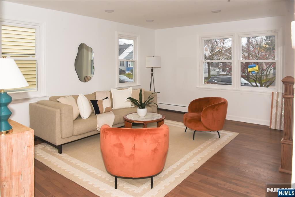 47 Elston Street Bloomfield, NJ 07003 - Photo 6 of 38 a living room with furniture and a large window