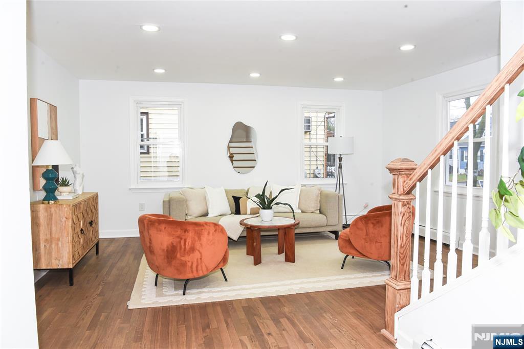47 Elston Street Bloomfield, NJ 07003 - Photo 7 of 38 a living room with furniture and a wooden floor
