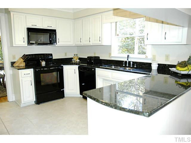12613 Waterman Drive Raleigh, NC 27614 - Photo 6 of 25 To the left of the kitchen is the formal dining room. Convenient for entertaining! Kitchen