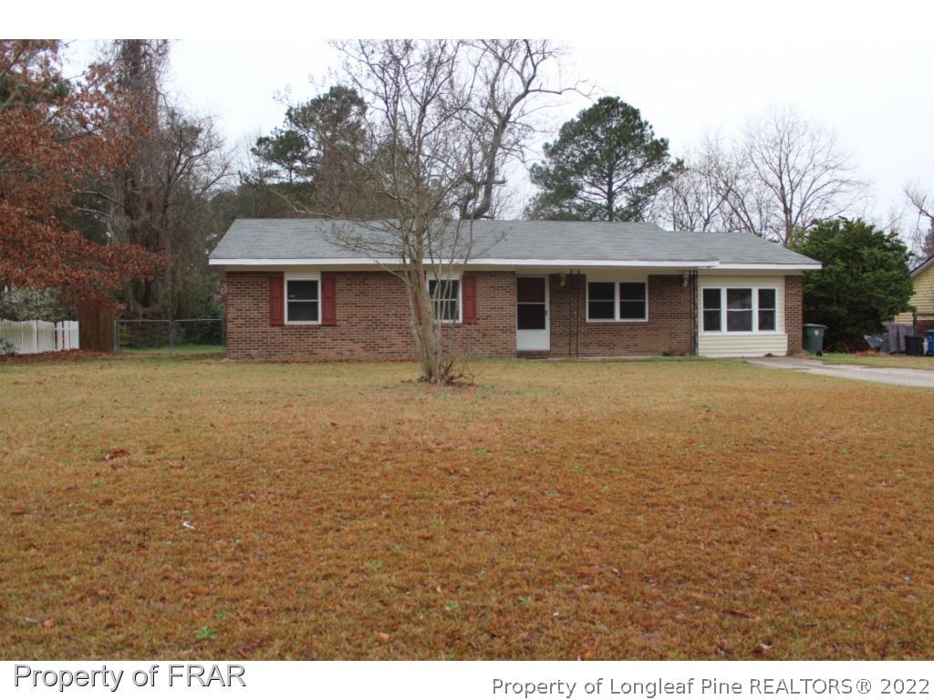6490 Green Meadow Road Fayetteville, NC 28304 - Photo 1 of 22 a view of a house with a yard