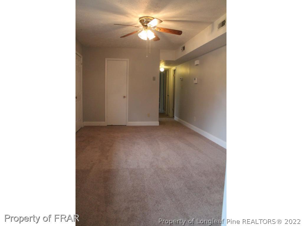 6490 Green Meadow Road Fayetteville, NC 28304 - Photo 4 of 22 a view of a room with a ceiling fan