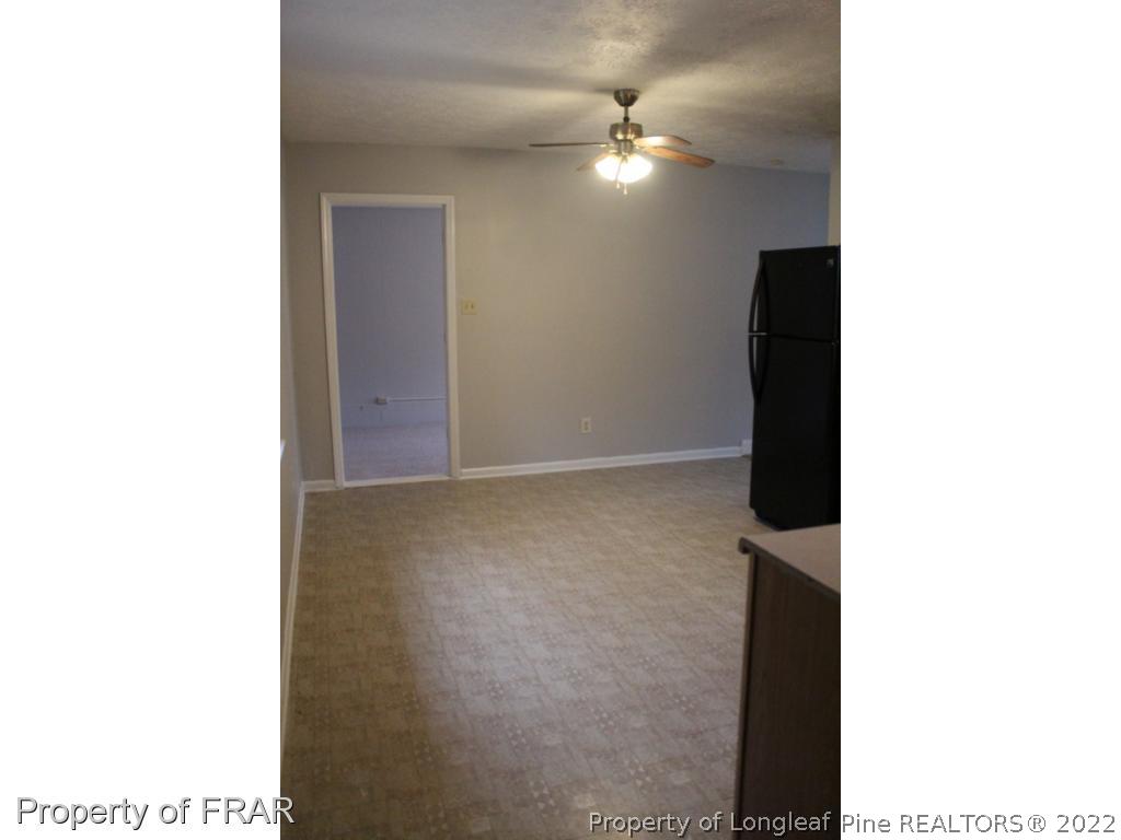 6490 Green Meadow Road Fayetteville, NC 28304 - Photo 6 of 22 a picture of a room with a window and a ceiling fan