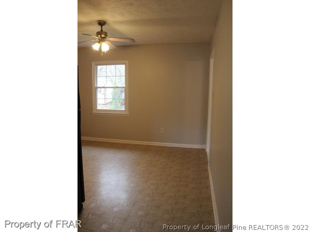 6490 Green Meadow Road Fayetteville, NC 28304 - Photo 7 of 22 a view of a room with a window and a bathroom