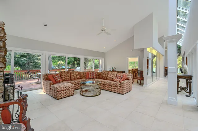 a view of a dining room with furniture and a window