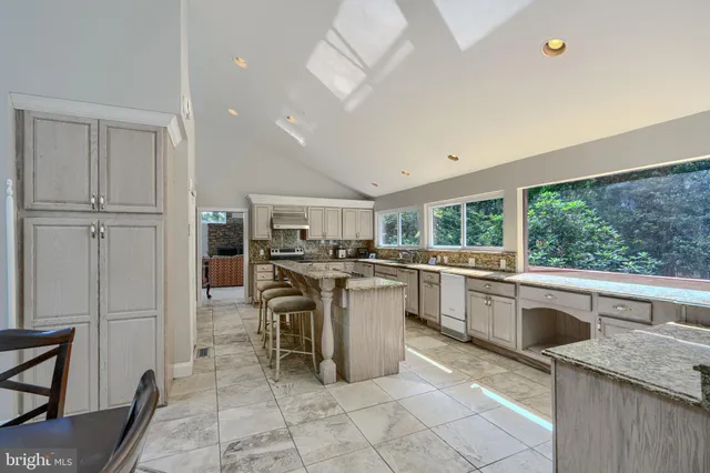 a bathroom with a sink vanity and a mirror
