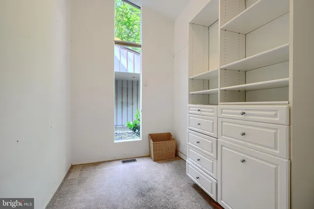 a bathroom with a sink a toilet a mirror and shower