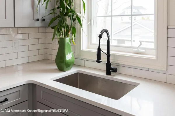 a kitchen with a sink and a window
