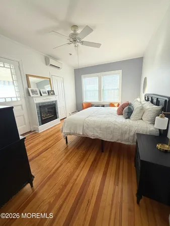 a bedroom with a bed and a fireplace