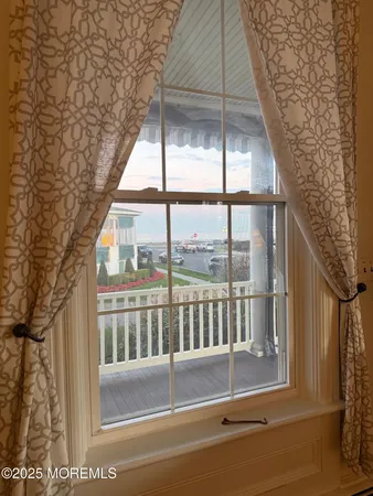 a view of entryway with a floor to ceiling window