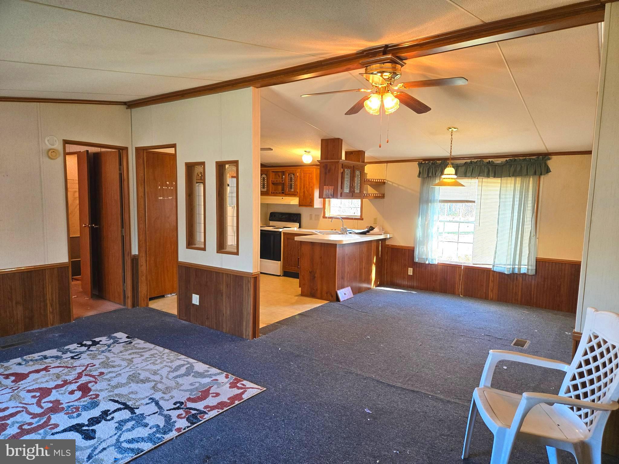 196 Foster Drive Falling Waters, WV 25419 - Photo 15 of 50 a living room with large window and a couch