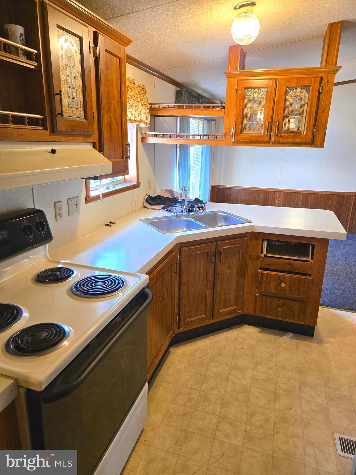 196 Foster Drive Falling Waters, WV 25419 - Photo 18 of 50 a kitchen with a stove a sink and a microwave
