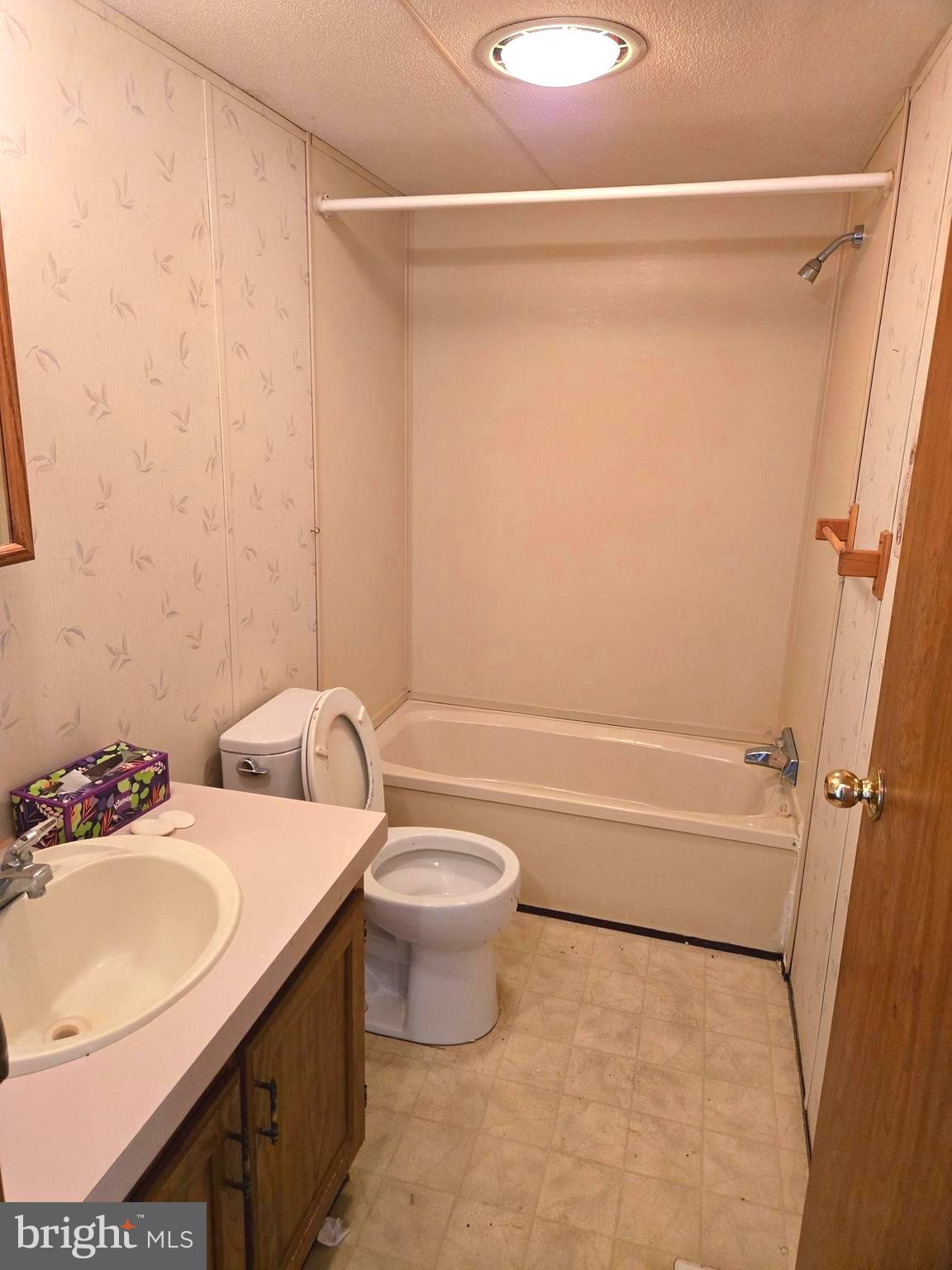 196 Foster Drive Falling Waters, WV 25419 - Photo 25 of 50 a bathroom with a granite countertop bathtub shower sink vanity and toilet