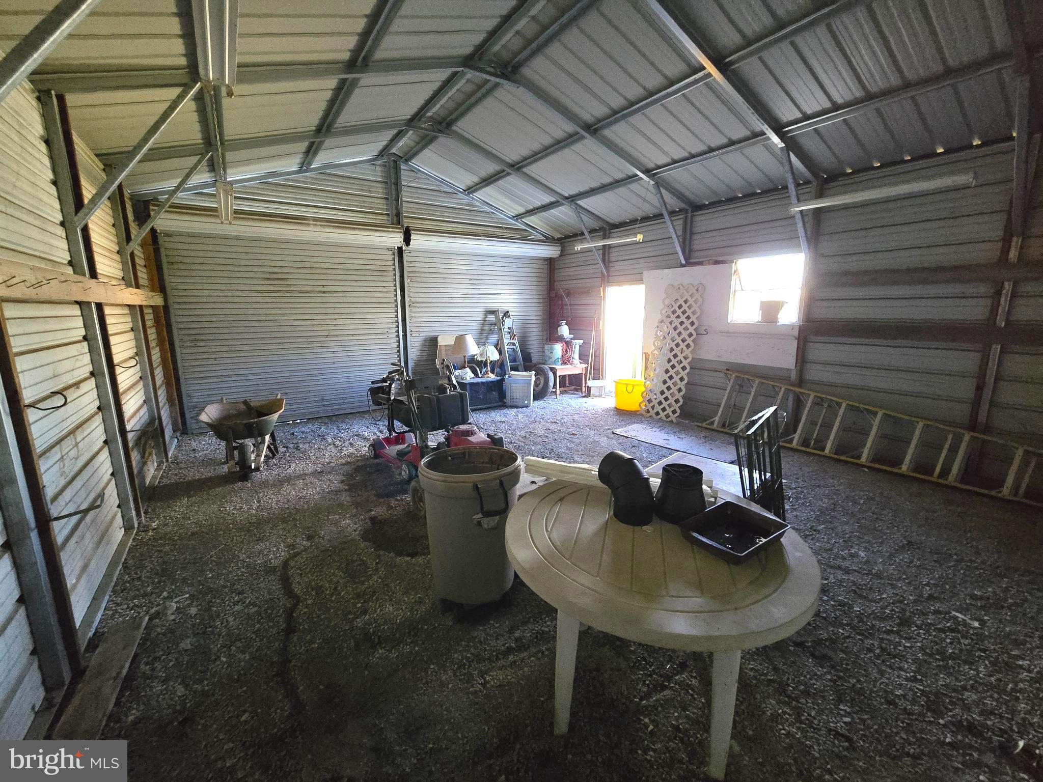196 Foster Drive Falling Waters, WV 25419 - Photo 28 of 50 a view of a patio with table and chairs
