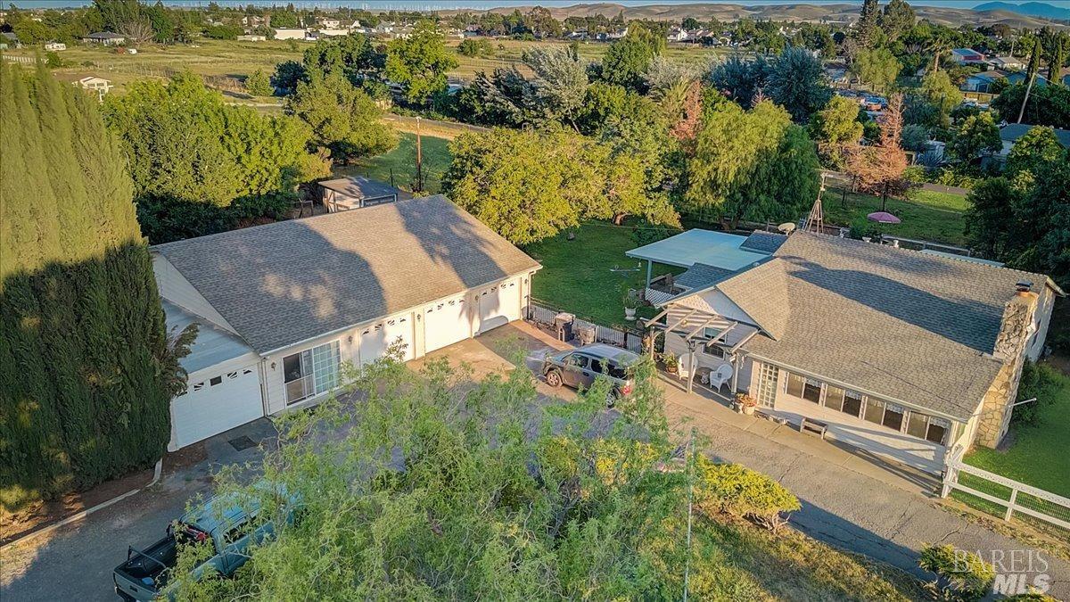 an aerial view of a house with a garden