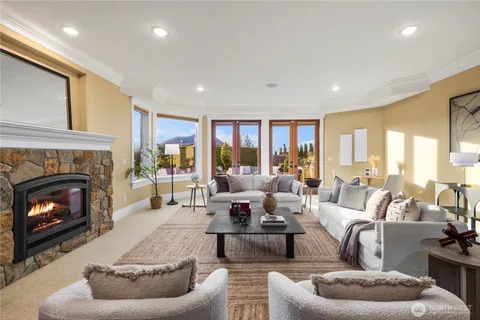 a living room with furniture and view of kitchen