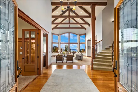 a lobby with furniture and floor to ceiling window