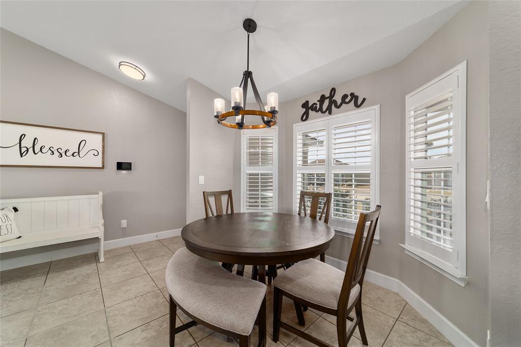 9155 Southeast 47th Court Road Ocala, FL 34480 - Photo 14 of 47 a view of a dining room with furniture window and outside view