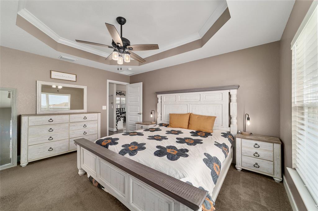 9155 Southeast 47th Court Road Ocala, FL 34480 - Photo 26 of 47 a bedroom with a bed and a dresser