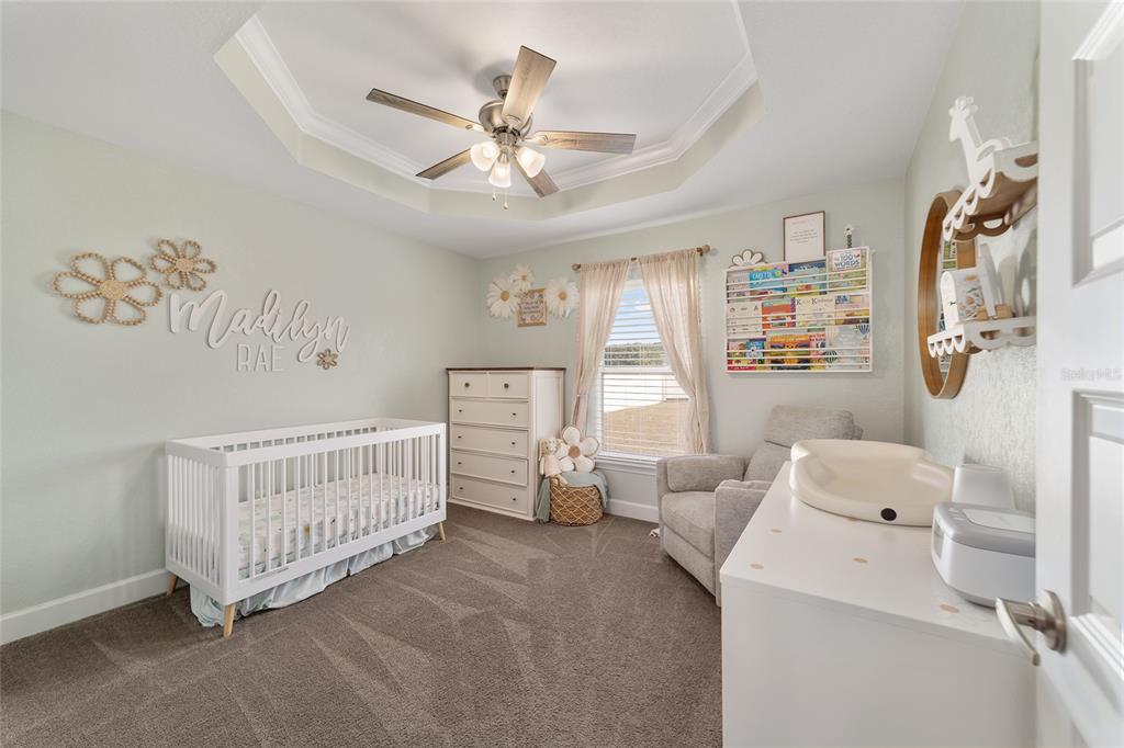 9155 Southeast 47th Court Road Ocala, FL 34480 - Photo 32 of 47 a room with furniture and a chandelier