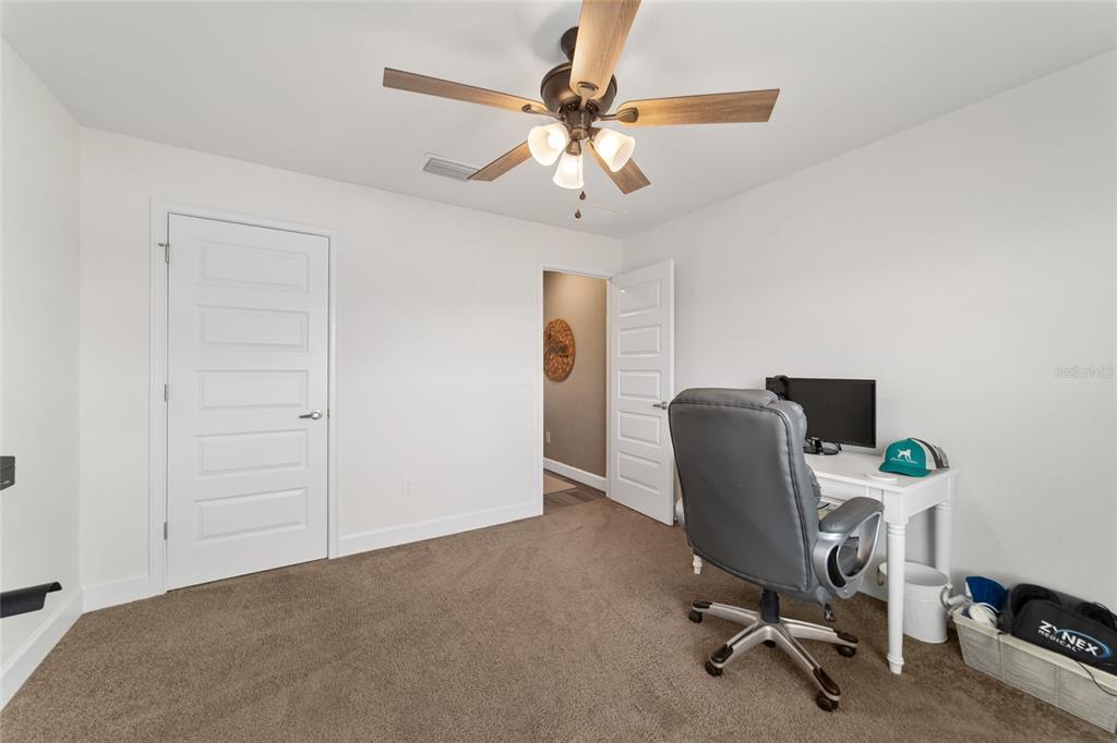 9155 Southeast 47th Court Road Ocala, FL 34480 - Photo 36 of 47 a view of a workspace with furniture and a window