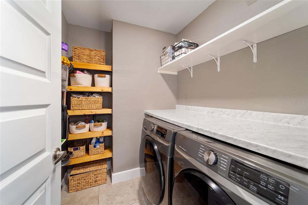 9155 Southeast 47th Court Road Ocala, FL 34480 - Photo 38 of 47 a utility room with dryer and washer