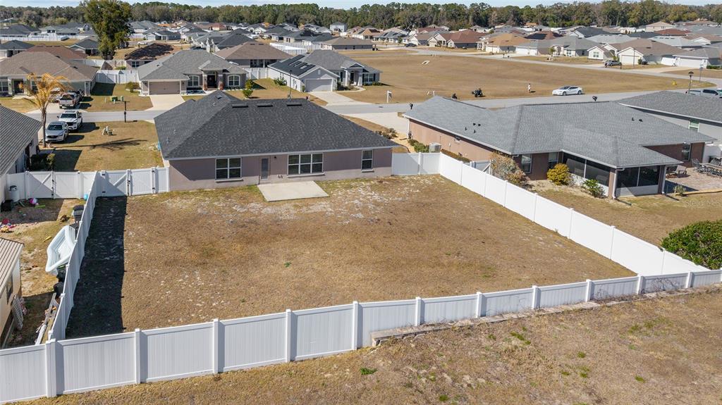 9155 Southeast 47th Court Road Ocala, FL 34480 - Photo 43 of 47 an aerial view of residential houses with outdoor space