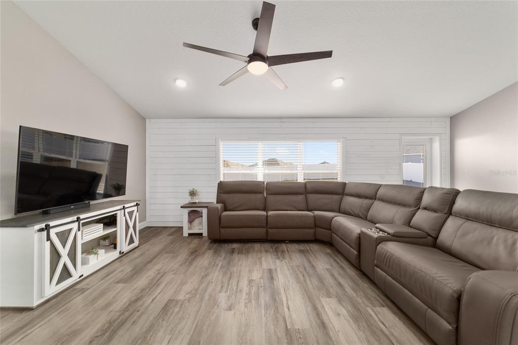 9155 Southeast 47th Court Road Ocala, FL 34480 - Photo 9 of 47 a living room with furniture and a flat screen tv