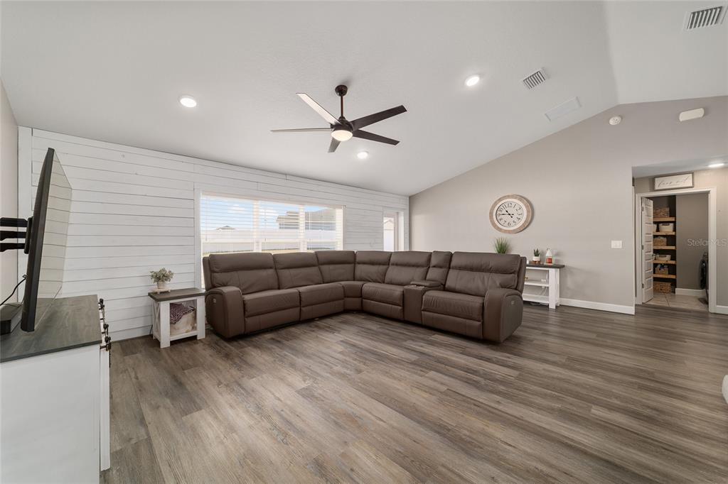 9155 Southeast 47th Court Road Ocala, FL 34480 - Photo 10 of 47 a living room with furniture and wooden floor