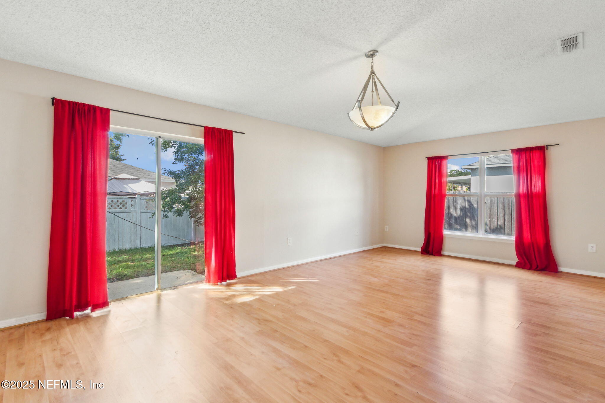 7364 Edenfield Park Road Jacksonville, FL 32244 - Photo 11 of 31 a view of a room with wooden floor and windows