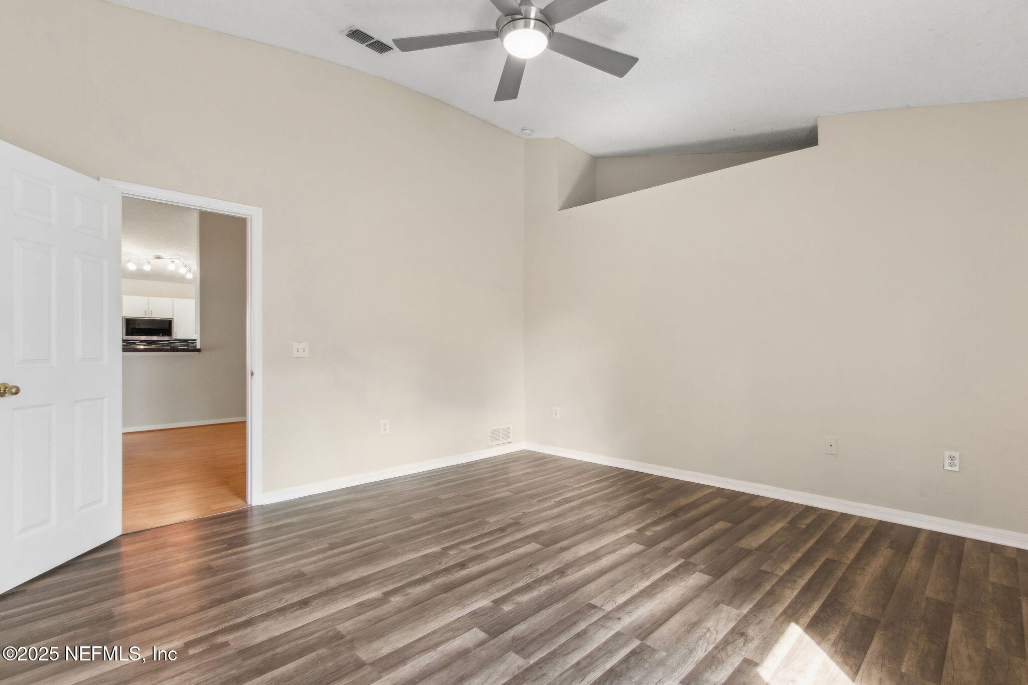 7364 Edenfield Park Road Jacksonville, FL 32244 - Photo 21 of 31 wooden floor in an empty room with a window