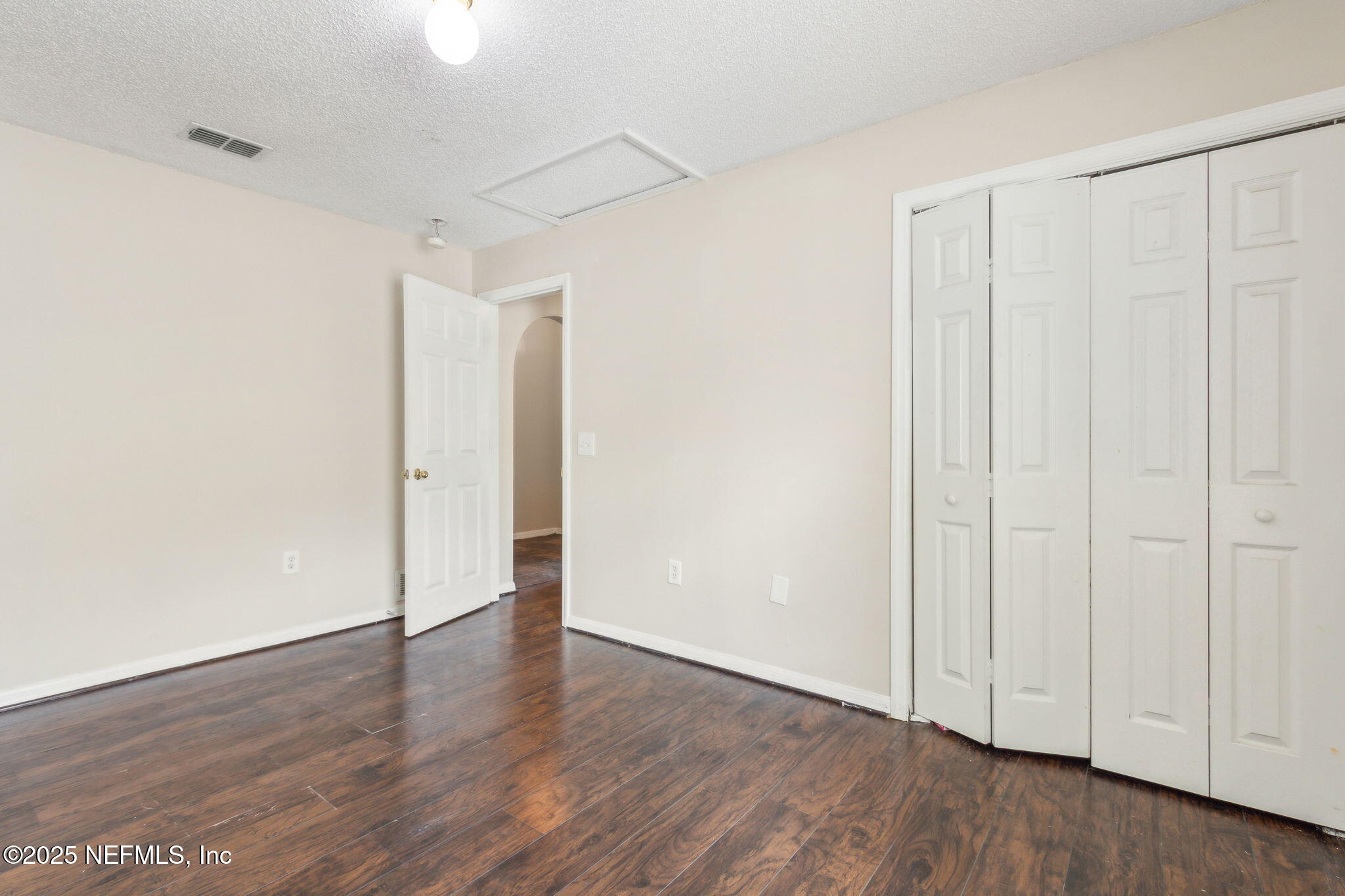 7364 Edenfield Park Road Jacksonville, FL 32244 - Photo 25 of 31 a view of an empty room with wooden floor