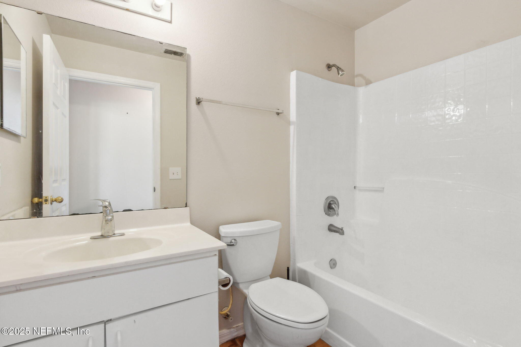 7364 Edenfield Park Road Jacksonville, FL 32244 - Photo 26 of 31 a white toilet sitting next to a bathroom sink