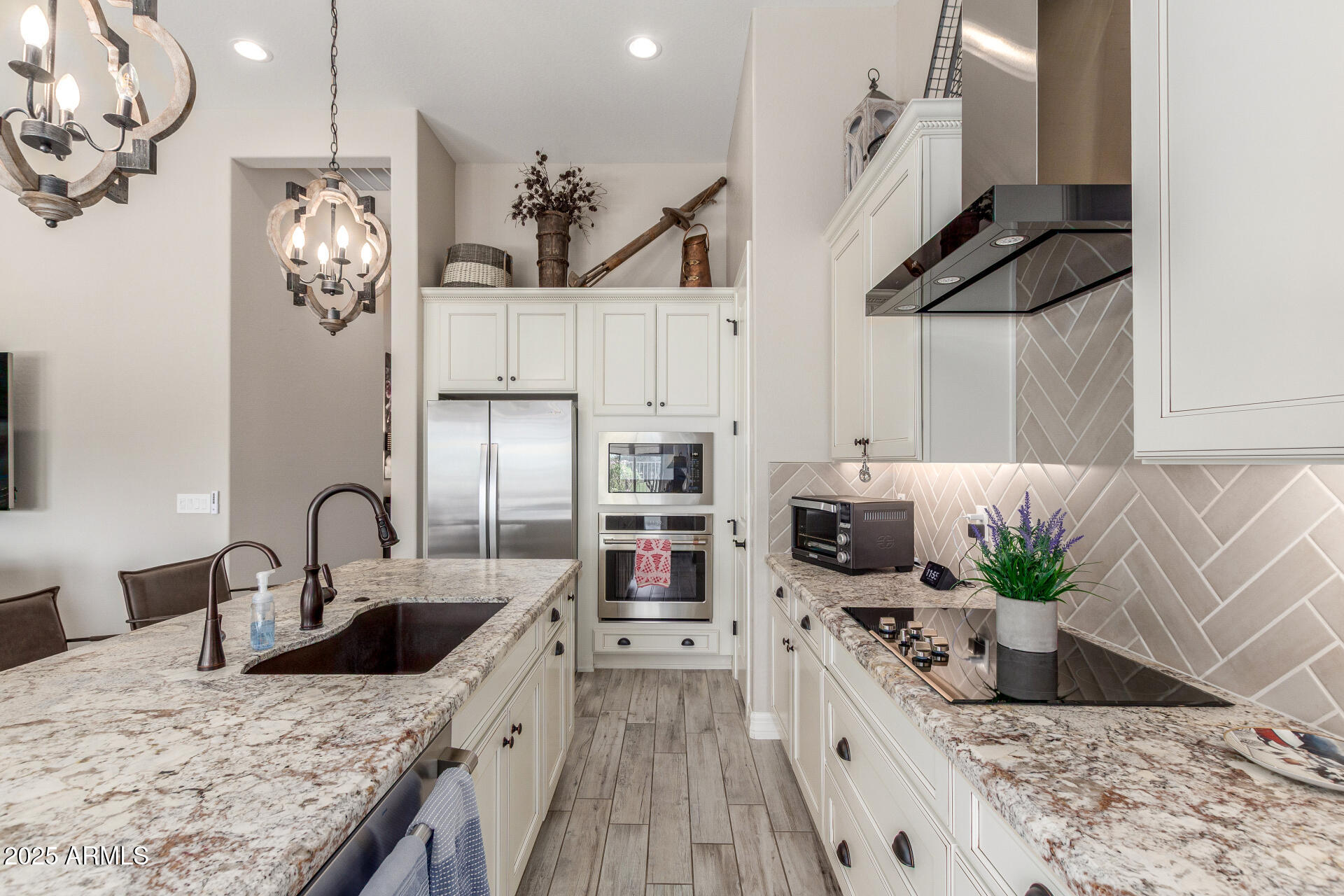 18805 East Blue Sky Drive Rio Verde, AZ 85263 - Photo 11 of 43 a kitchen with stainless steel appliances granite countertop a sink a stove and a wooden floors