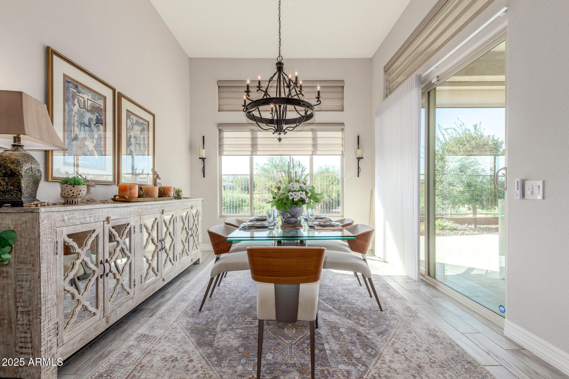 18805 East Blue Sky Drive Rio Verde, AZ 85263 - Photo 13 of 43 a dining room with furniture a chandelier and wooden floor