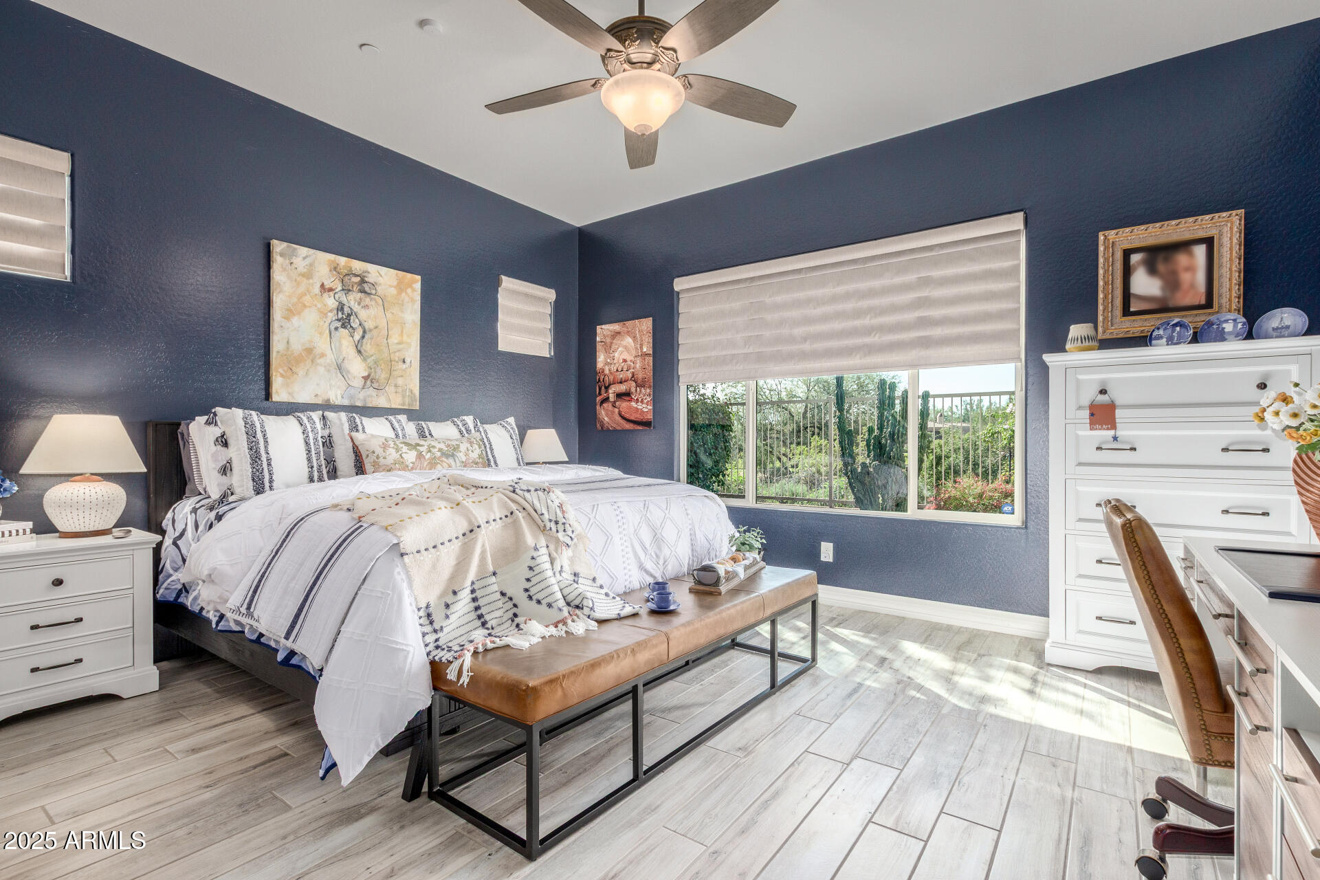 18805 East Blue Sky Drive Rio Verde, AZ 85263 - Photo 14 of 43 a bed sitting in a bedroom next to a window