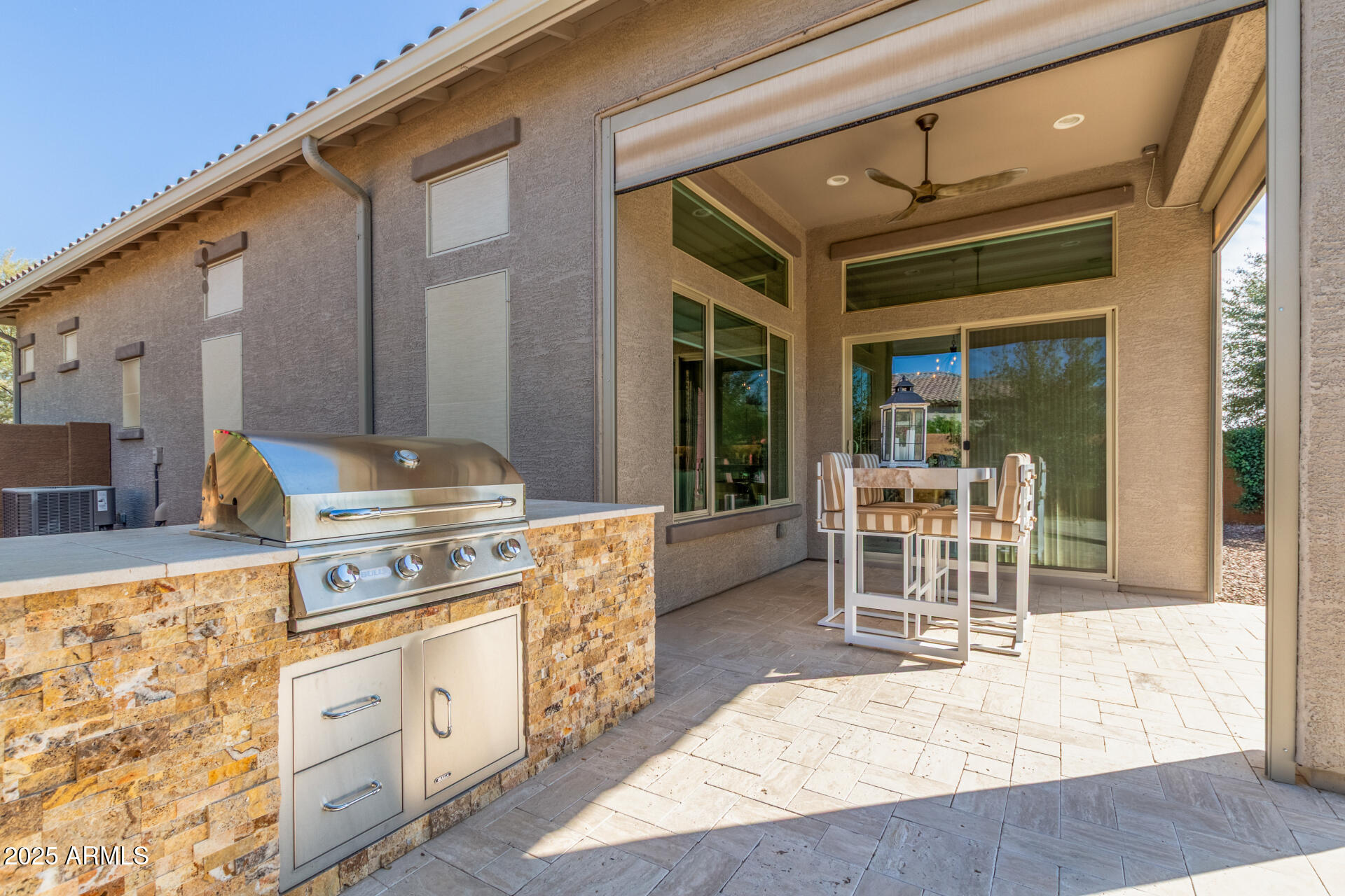 18805 East Blue Sky Drive Rio Verde, AZ 85263 - Photo 28 of 43 a kitchen with stainless steel appliances granite countertop a stove a sink and a dining table chair