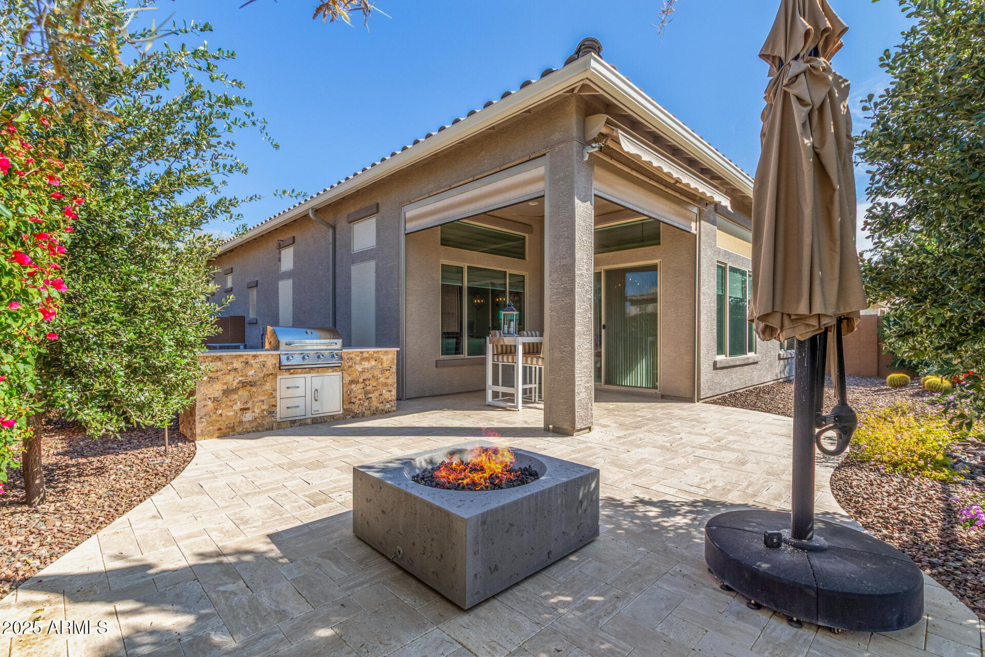 18805 East Blue Sky Drive Rio Verde, AZ 85263 - Photo 29 of 43 a front view of a house with garden