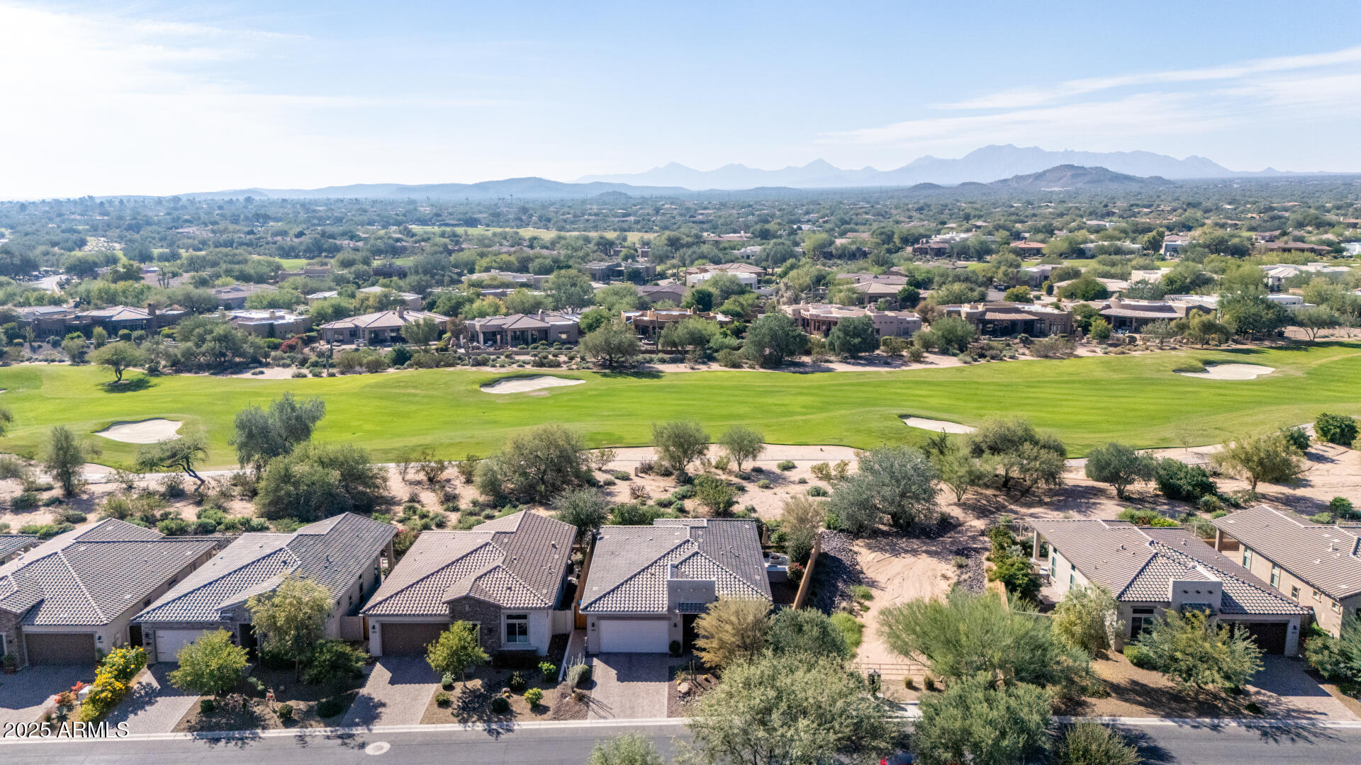 18805 East Blue Sky Drive Rio Verde, AZ 85263 - Photo 38 of 43 an aerial view of a city with lots of residential buildings and mountain view in back