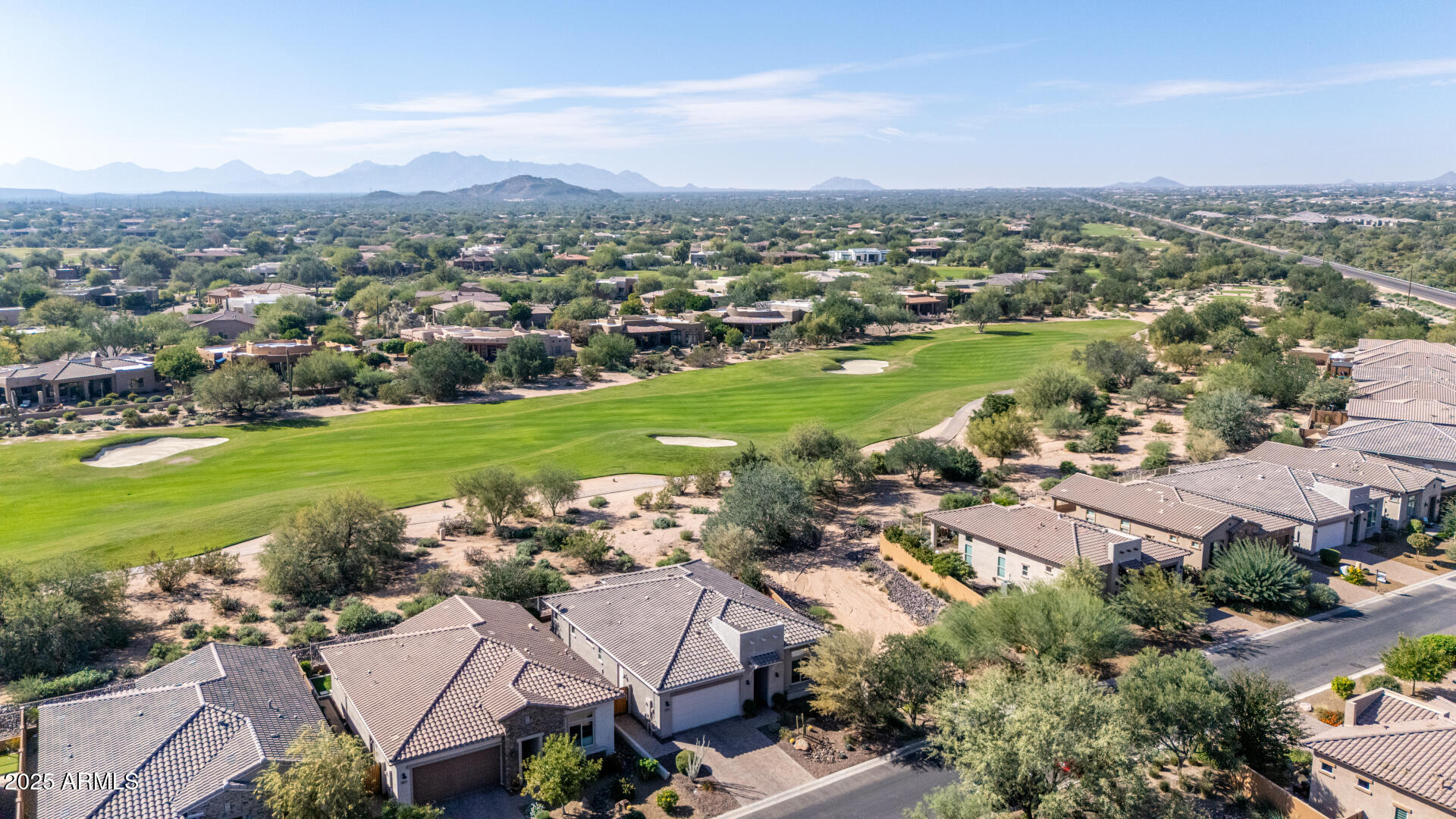 18805 East Blue Sky Drive Rio Verde, AZ 85263 - Photo 39 of 43 an aerial view of a city with lots of residential buildings ocean and mountain view in back