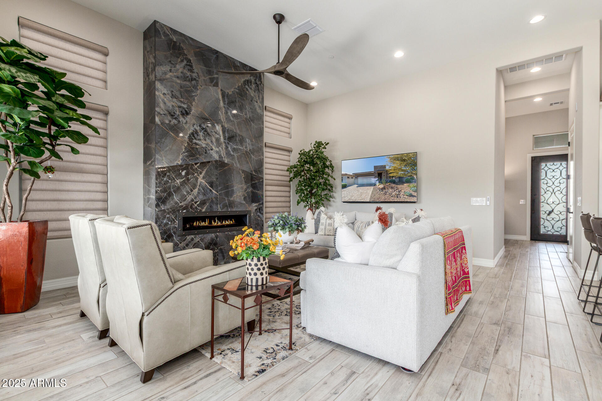 18805 East Blue Sky Drive Rio Verde, AZ 85263 - Photo 7 of 43 a living room with furniture and a fireplace