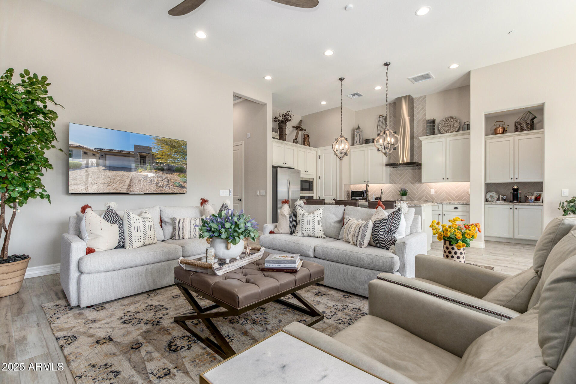 18805 East Blue Sky Drive Rio Verde, AZ 85263 - Photo 8 of 43 a living room with furniture kitchen view and a potted plant